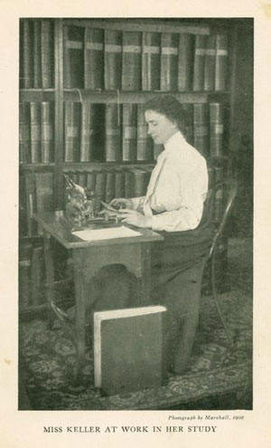 Helen Keller working in her study