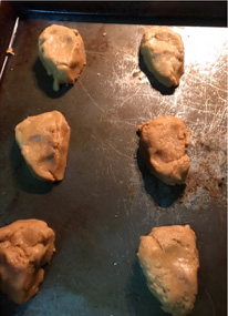 Make dough into a triangle shape to form the face of the reindeer.